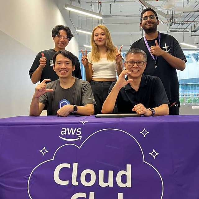 Organisers and speakers behind an AWS Cloud Club banner at AI Day at SIT